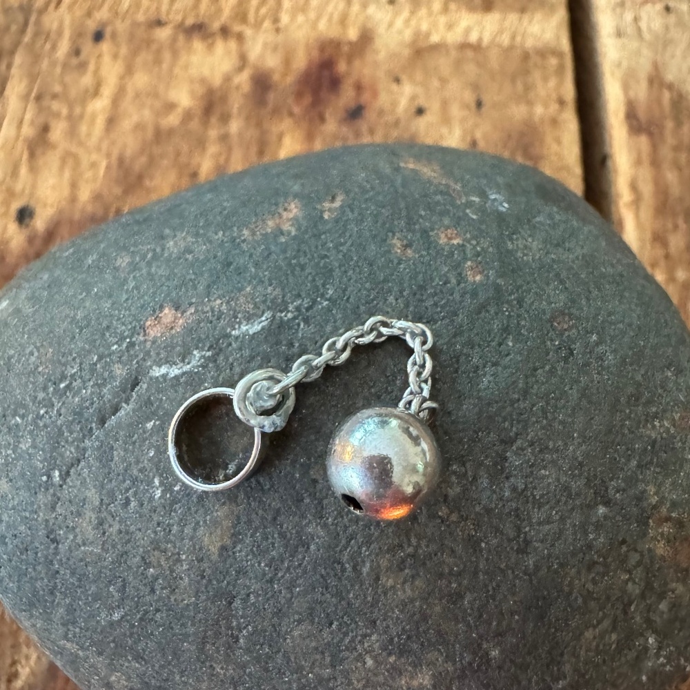The ole ball and chain in a charm! Great gag gift!
